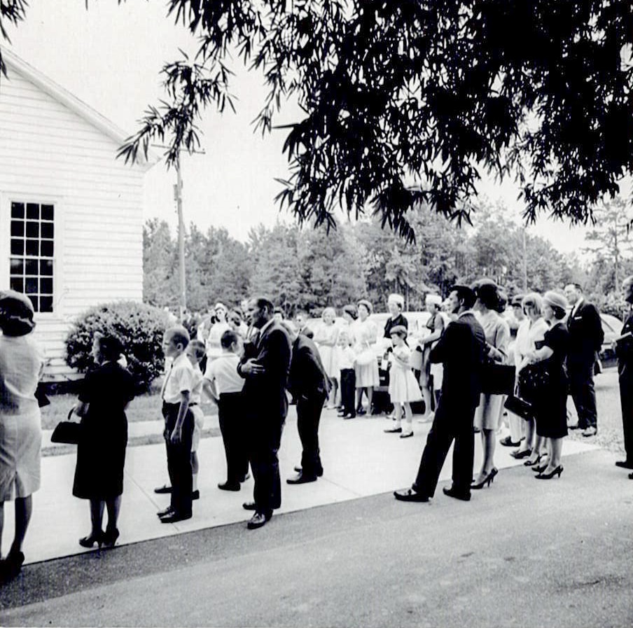 Members gathered outside Oakhurst’s first sanctuary.
